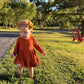 Burnt Orange Twirl Dress